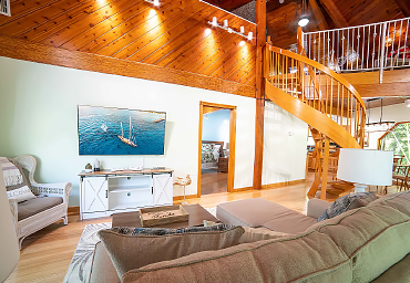 Living Room and Spiral Staircase Leading to the Loft Bedroom